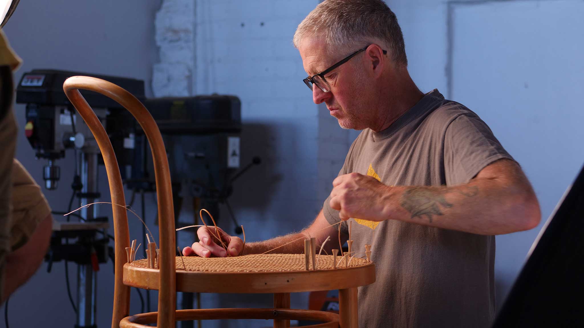David Johnson caning a chair at Allied Woodshop for the Craft Video Dictionary CVD