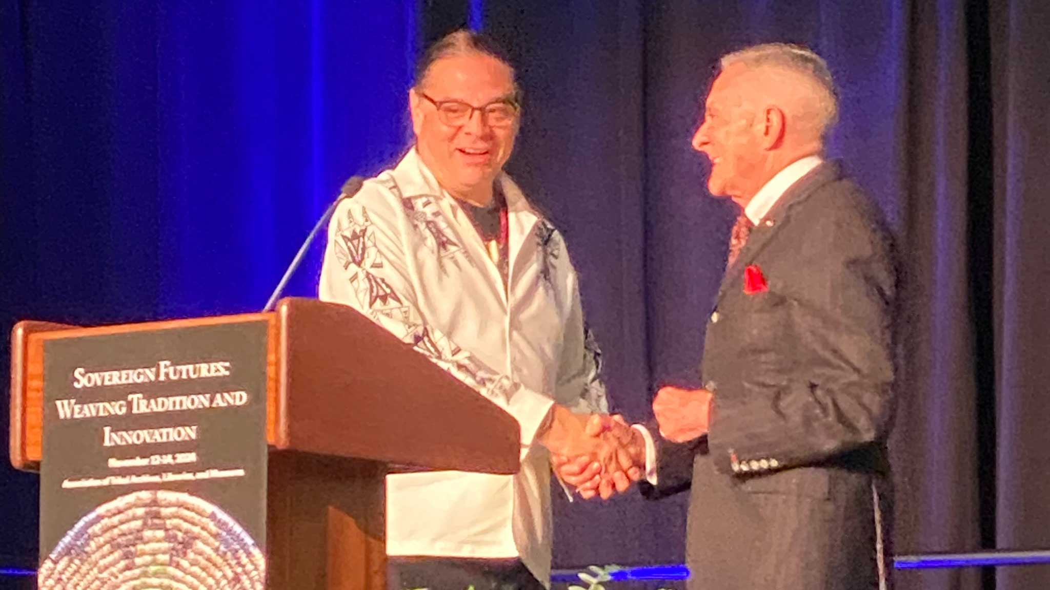 Conference chair Rick West welcoming Sean Sherman, the Sioux Chef to the ATALM stage to receive his award