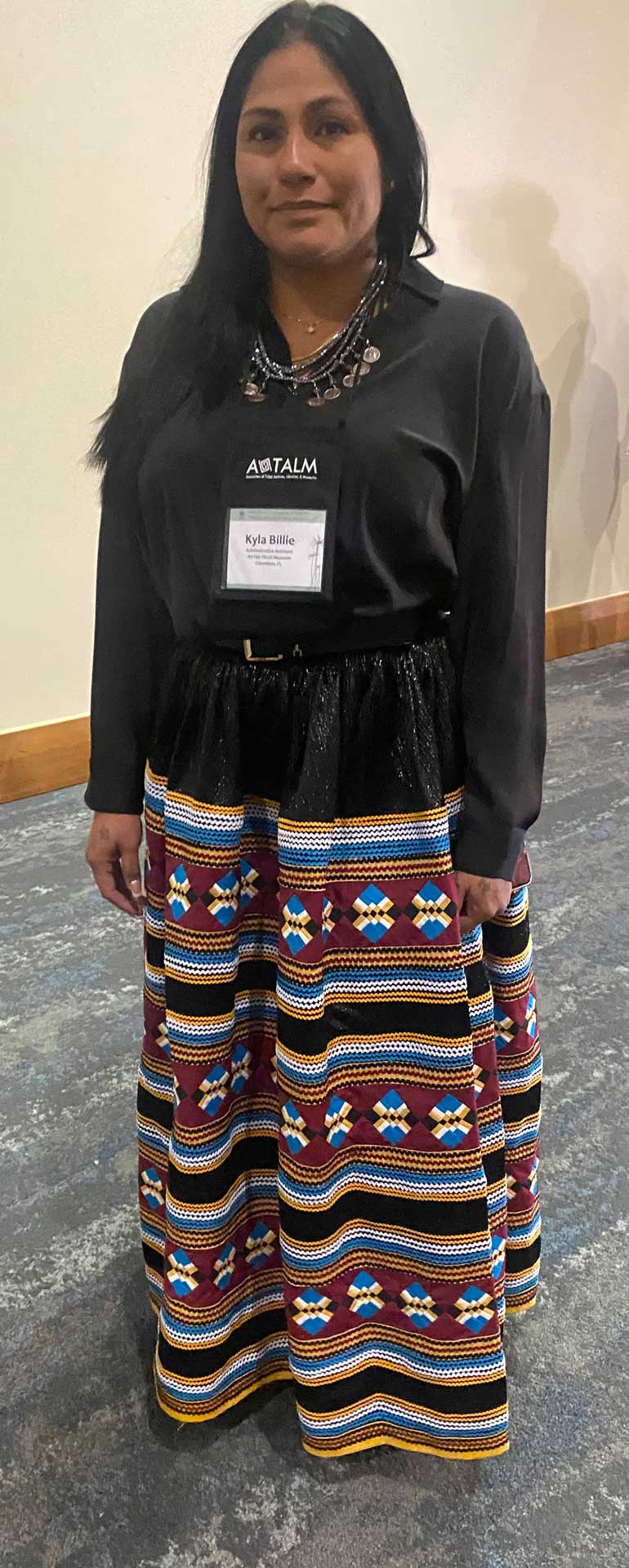 Kyla Billie wearing an intricate Seminole patchwork skirt.