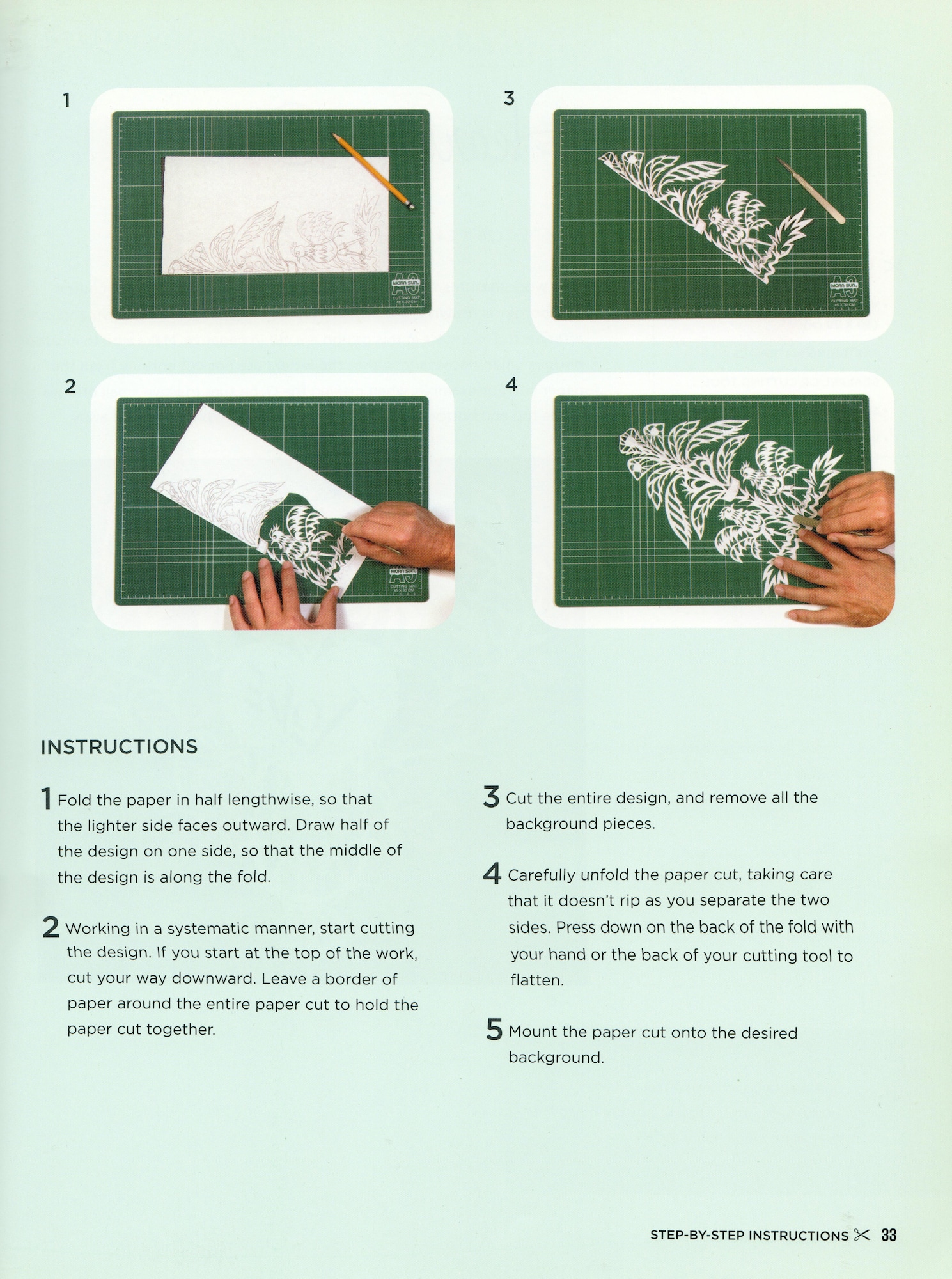 4 photos show progression of folded piece of paper with a sketch, that gradually is cut, to reveal a symmetrical plants and mirrored chickens design